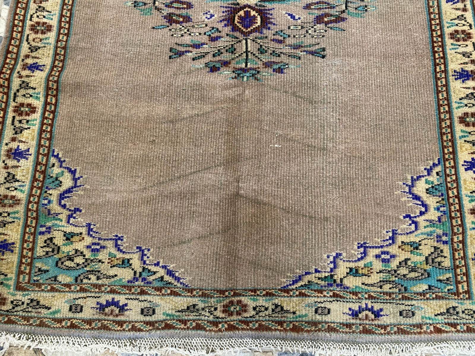 Vintage Turkish Rug | 5.4 x 8.7 ft Hand-Knotted Wool Faded Pastel Anatolian Rug