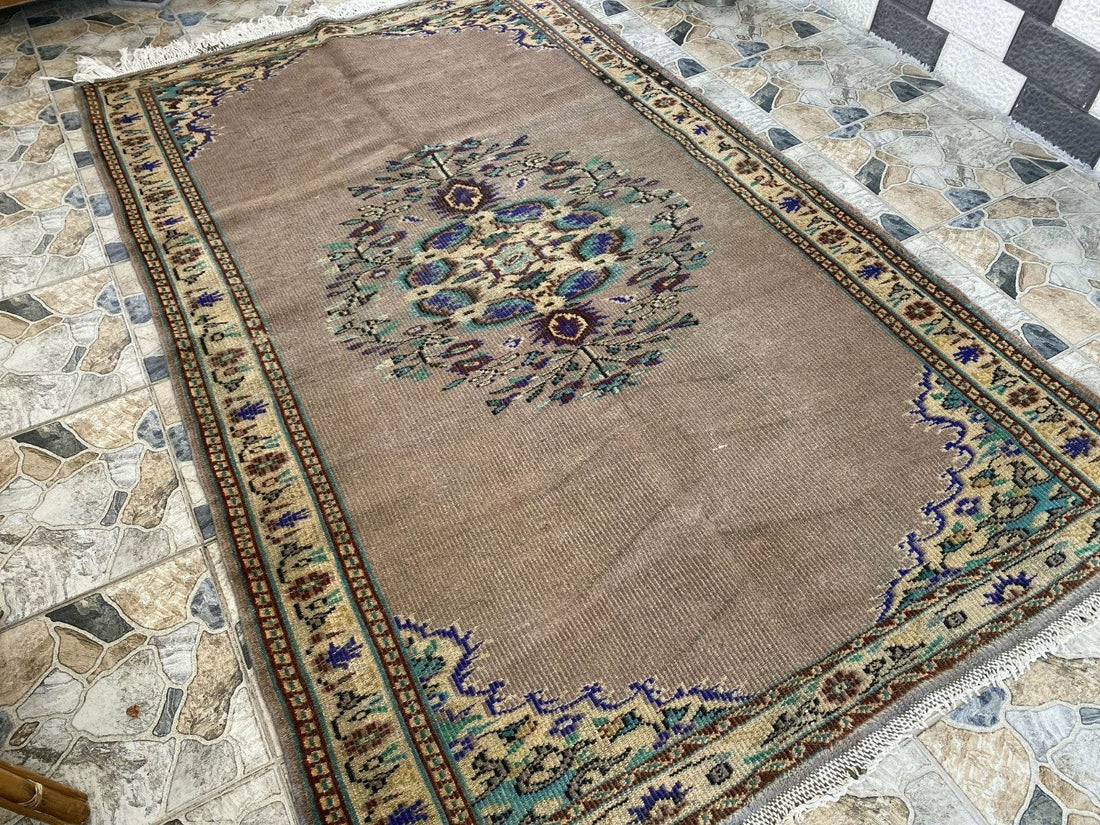 Vintage Turkish Rug | 5.4 x 8.7 ft Hand-Knotted Wool Faded Pastel Anatolian Rug