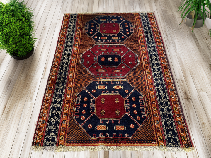 Vintage Hand-Knotted Turkish Area Rug | 4.1 x 5.6 ft | Distressed Geometric Rug